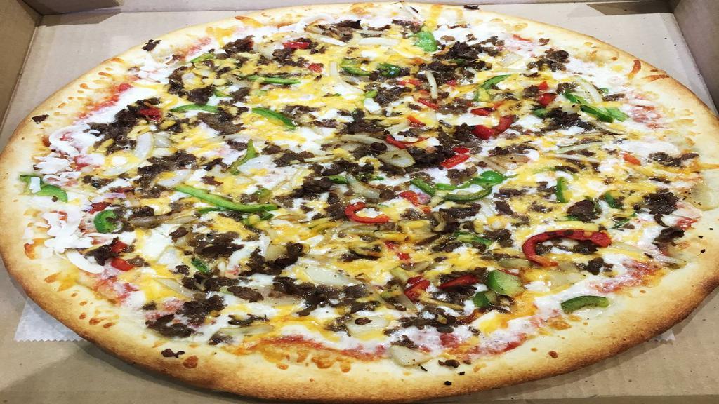 Philly Cheese Steak Pizza · Comes with philly cheesesteak, red pepper, green pepper and American cheese.