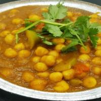 Chana Masala (Chick Pea) · Served with rice or bread. Base gravy. Onion sauce, Indian herbs and spices.