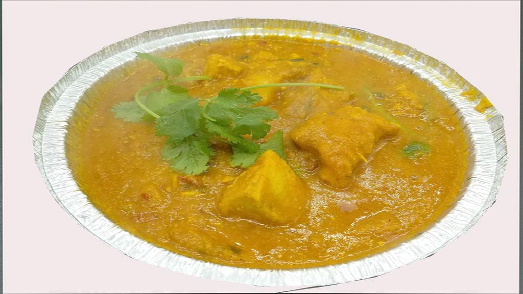 Boneless Chicken Curry · Served with rice or bread. Base gravy. Onion sauce, Indian herbs and spices