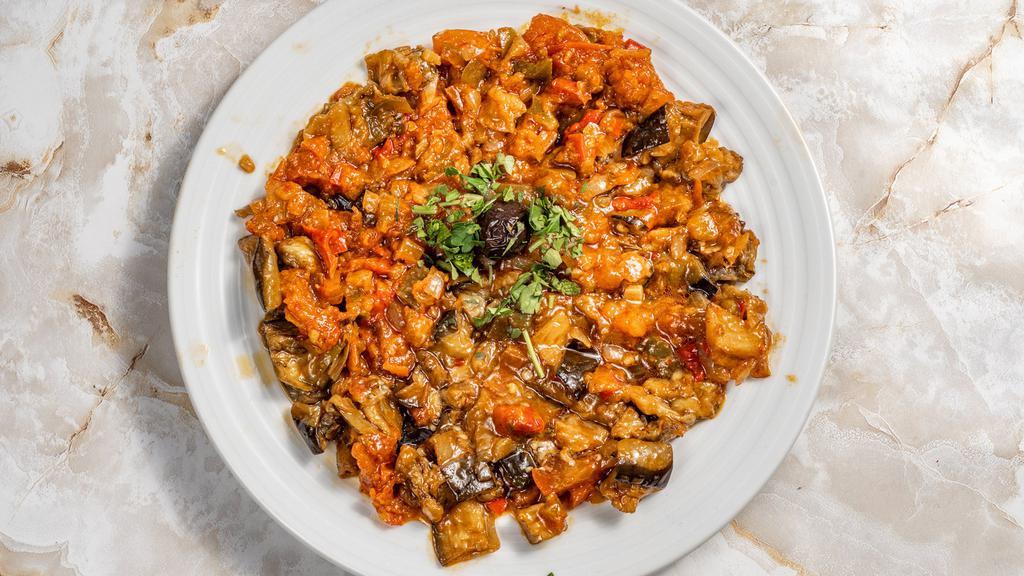 Sauced Eggplant Salad · Small pieces of eggplant in moderately sauce of fresh tomatoes, peppers, onions, garlic and parsley.