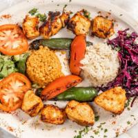 Chicken Shish Kebab · Ground chicken seasoned with spices and red bell peppers is set on a flat skewer and charbro...