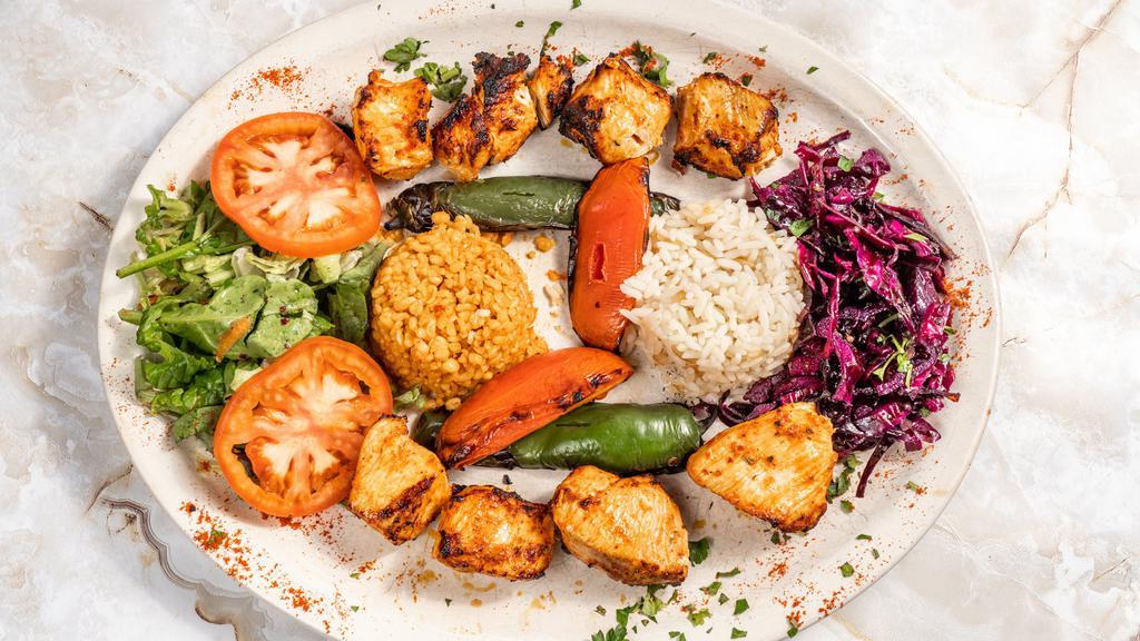 Chicken Shish Kebab · Tender chunks of chicken marinated with chef's own blend of herbs served with salad and rice.