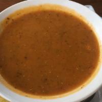 Lentil Soup · Pureed red lentils topped with crushed red peppers and mint