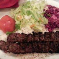 Adana Kebab · Ground lamb flavored with red bell peppers, slightly seasoned with paprika and grilled on sk...