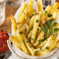 Garlic French Fries · Delectable fries decorated with garlic.
