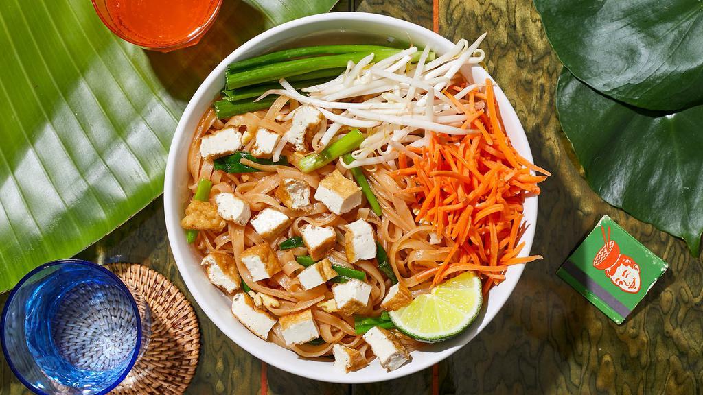 Tofu Pad Thai · Stir-fried rice noodles with tofu, scallions, bean sprouts, scrambled egg, and crushed peanuts.