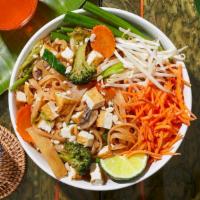 Vegan Pad Thai · Stir-fried rice noodles with tofu, scallions, bean sprouts, mixed vegetables, and crushed pe...