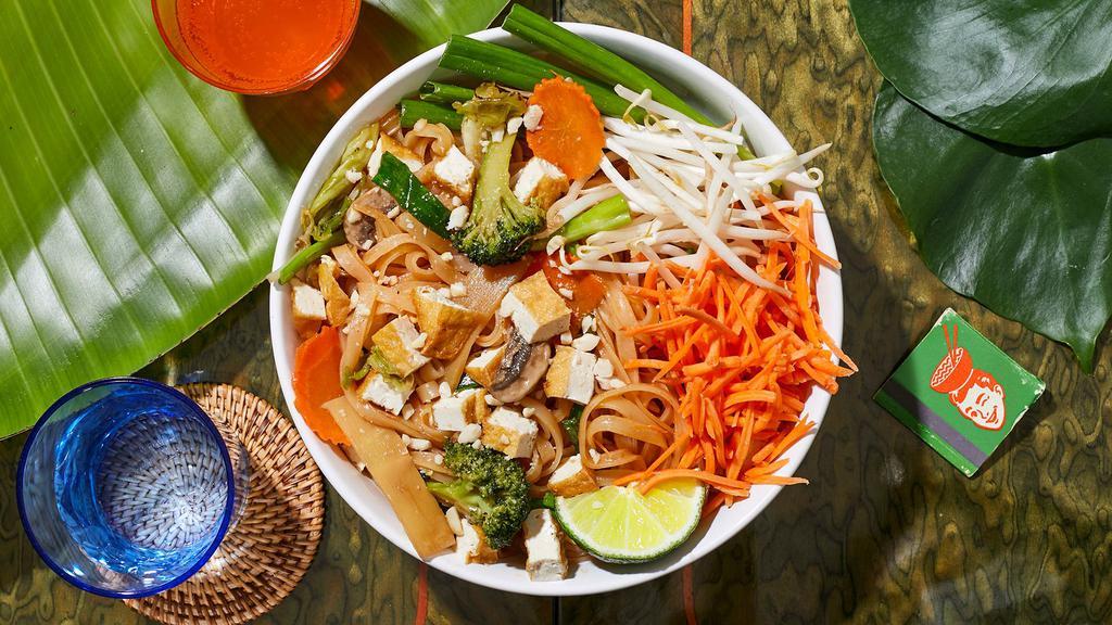Vegan Pad Thai · Stir-fried rice noodles with tofu, scallions, bean sprouts, mixed vegetables, and crushed peanuts.