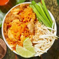 Triple Meat Pad Thai · Stir-fried rice noodles with chicken, fish and shrimp, scallions, bean sprouts, scrambled eg...