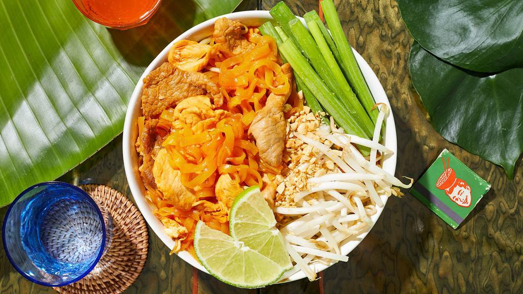 Triple Meat Pad Thai · Stir-fried rice noodles with chicken, fish and shrimp, scallions, bean sprouts, scrambled egg, and crushed peanuts.
