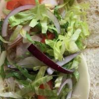 Turkey Club Sandwich · Lettuce, tomatoes, mayo, and bacon.