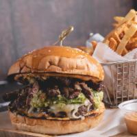 El Arepalicious Burger With French Fries · Beef, grilled steak, guacamole, mozzarella cheese, and sauce.
Carne, carne asada, guacamole,...