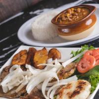 Grilled Steak With Sautéed Onions (Bistec Encebollado) · Grilled steak with sautéed onions with rice, beans, sweet plantain and arepa.
Bistec encebol...