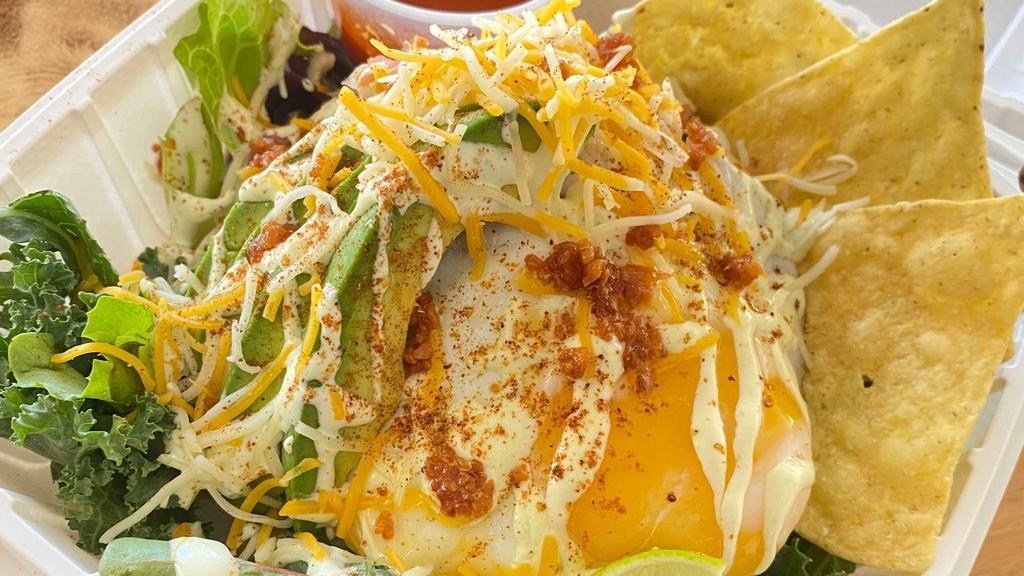 Ash Spicy Taco Rice · Original meat sauce over the rice and Tajin spice and Cajun spice, avocado, fried garlic, shredded cheese and fresh green with Caesar dressing and salsa sauce, fried egg on top. Come with side hot sauce.