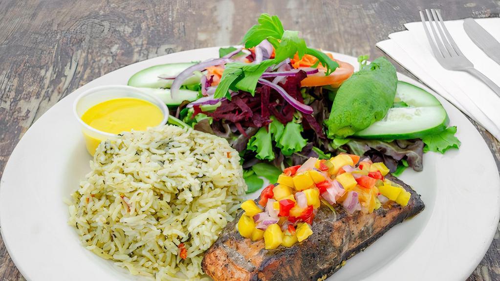 Grilled Jerk Salmon · Topped with tropical mango salsa and served with basmati spinach rice pilaf cooked with coconut cream and spices. Plus mixed green salad with shredded carrots, beets, onions, tomatoes, cucumber and avocado. Substitute for Quinoa pilaf