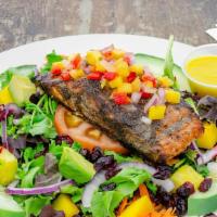Jerked Salmon Salad · Organic mixed greens topped with cucumber, shredded carrots, shredded beets, tomatoes, mango...