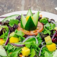 House Salad · Organic mixed greens topped with cucumber, shredded carrots, shredded beets, tomatoes, mango...