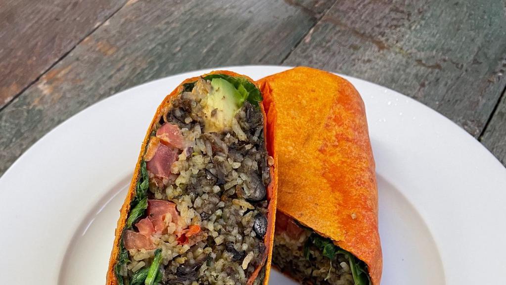 Vegan Burrito · Organic basmati rice, black beans, avocado, tomatoes, spinach, soy protein served with our vegan cashew chipotle sauce.