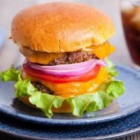 Cheeseburger · Juicy all beef patty topped with melty American cheese, fresh lettuce, tomato and house sauc...