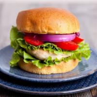 Chicken Burger · Crispy, breaded chicken patty with melty cheddar cheese, fresh lettuce and tomatoes with may...