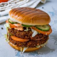 Falafel Burger · Crispy, fried, homemade falafel patty with fresh lettuce, tomato and onions with melted Swis...