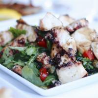 Charred Octopus · Served with a red wine dressing with roasted peppers and capers