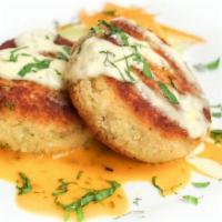 Crab Cakes · Served with broccoli slaw and lemon remoulade