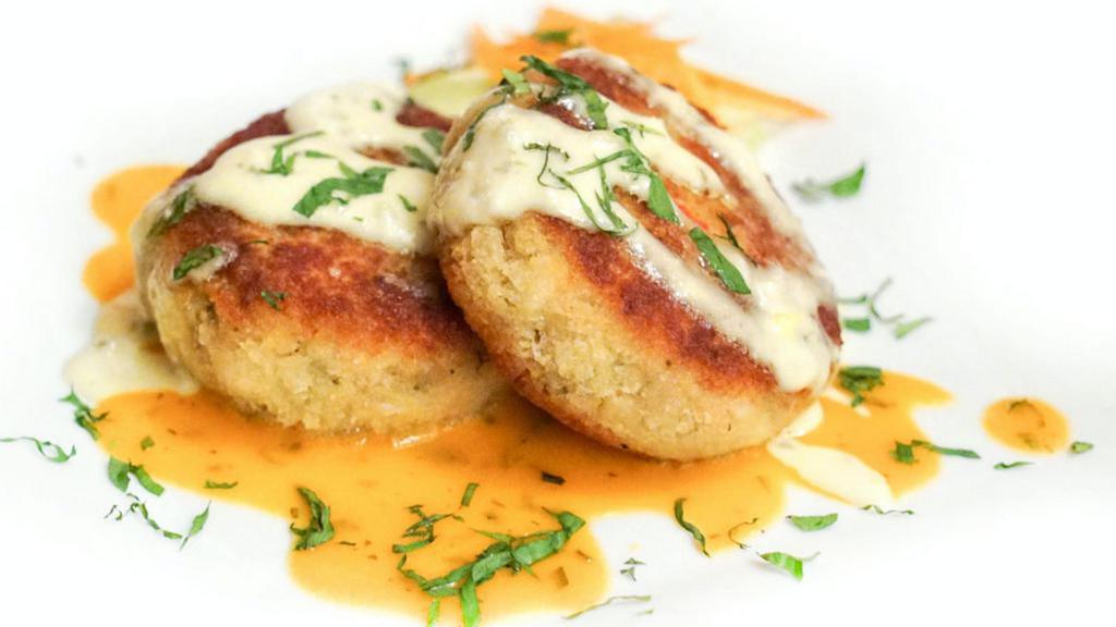 Crab Cakes · Served with broccoli slaw and lemon remoulade