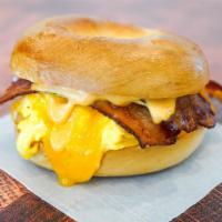 Bacon, Egg N Cheese · Your choice of bagel, 2 fresh cracked cage-free scrambled eggs, crispy bacon and melted Ched...