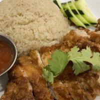Hainan Chicken Rice / 海南鸡饭 · Famous Hainan chicken rice served with chicken rice sauce. Serve with house special soup. / ...