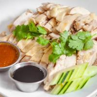 Hainan Chicken / 海南鸡 · Served with house special soup. / 送汤。.