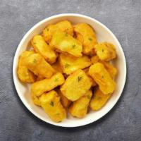 Paneer Pakora · Vegan cheese cubes that are golden fried in a seasoned chickpea batter.
