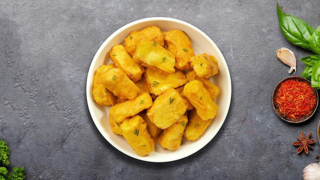 Paneer Pakora · Vegan cheese cubes that are golden fried in a seasoned chickpea batter.