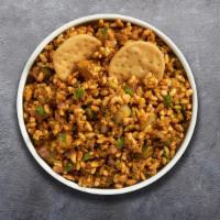 Ring The Bhel Puri · Assorted crispy wafers, puffed rice & fried Indian noodles topped with onions, potatoes, Ind...