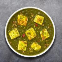 Saag Eyes Paneer · Cubes of vegan cheese cooked in a spinach gravy infused with garlic, ginger, and spices.