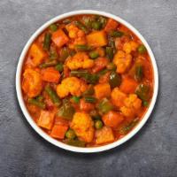 Veggie Korma'S Karma · Mixed vegetables cooked in delicate fresh spices, tomatoes and onions.