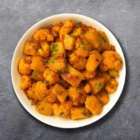 Masala Aloo Gobi · Stir fried potato and cauliflower with ginger and garlic.