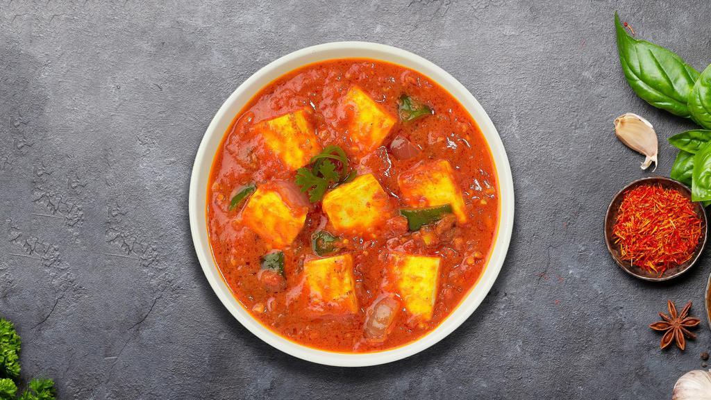 Key To Kadahi Paneer · Vegan cheese, bell pepper, onion, ginger, and garlic.