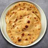 Roti Rollout · Whole wheat Indian bread cooked in a clay oven.