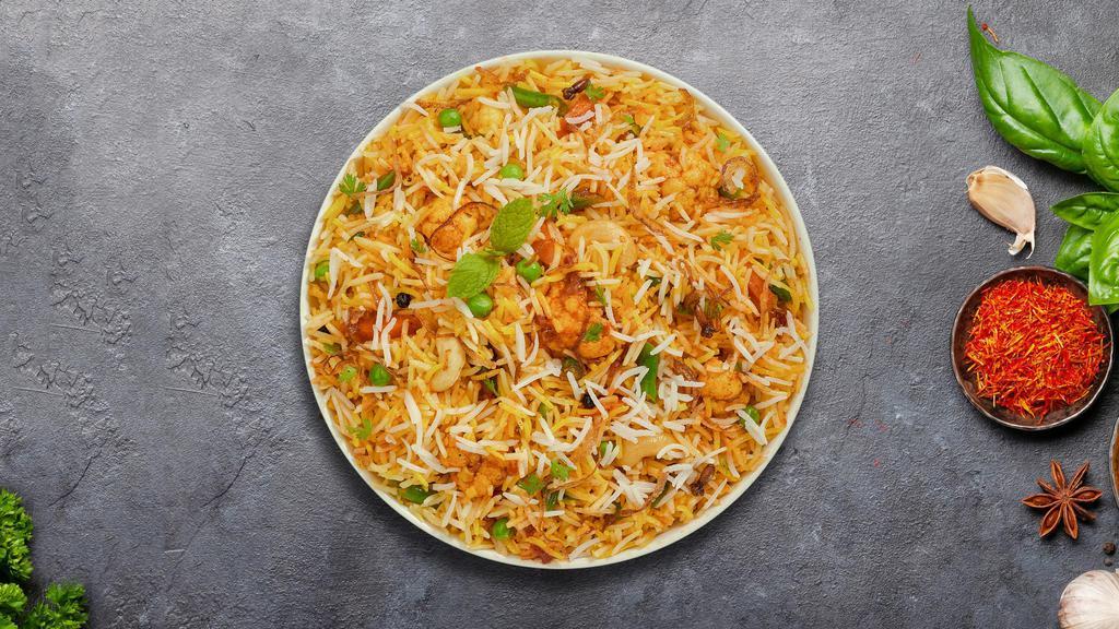 Vegetarian Feast Biryani · Spiced seasoned vegetables cooked with Indian spices and basmati rice. Served with house raita.