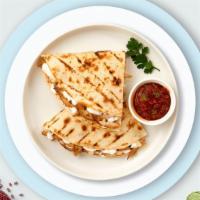 Veggie Wedgie Quesadilla · Roasted veggies wrapped with cheese in a grilled tortilla.