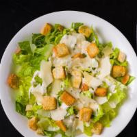 Caesar Salad  · romaine hearts, shaved parmesan, and croutons.