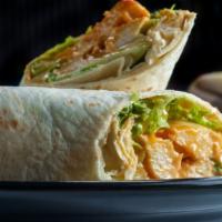 Spicy Buffalo Wrap · Juicy spicy chicken, hot sauce, lettuce, tomatoes, and blue cheese dressing.