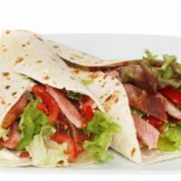 Turkey B.L.T. Wrap · Delicious wrap made with slices of turkey breast, turkey bacon, lettuce, tomatoes, and mayon...