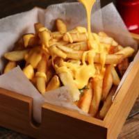 Cheese Fries · Hand cut fries freshly fried and topped with cheese.