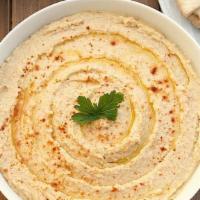 Hummus.  With One Pita · Our Home made hummus is smooth and silky made from Garbanzo beans(chick Peas ) blended with ...