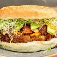 Watson Burger · Split peas patty, sweet plantains, sprouts,
onions, chips, cabbage, avocado
guasacaca and ro...
