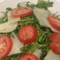 Arugula Salad · Topped with shaved kefalograviera cheese.