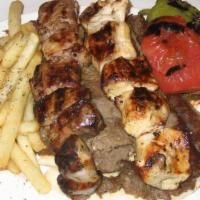 Gtm Combo Souvlaki Platter · Gyro, chicken and pork. Platters served with Greek fries, grilled sweet pepper, tomatoes, on...