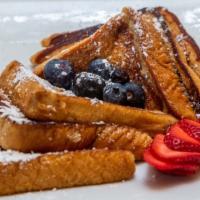 French Toast · Thick-sliced bread dipped in homemade batter and served golden brown.